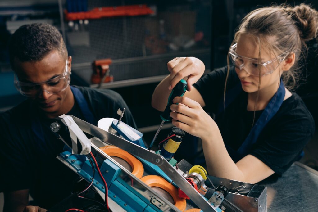 Two women working in a mechanical environment