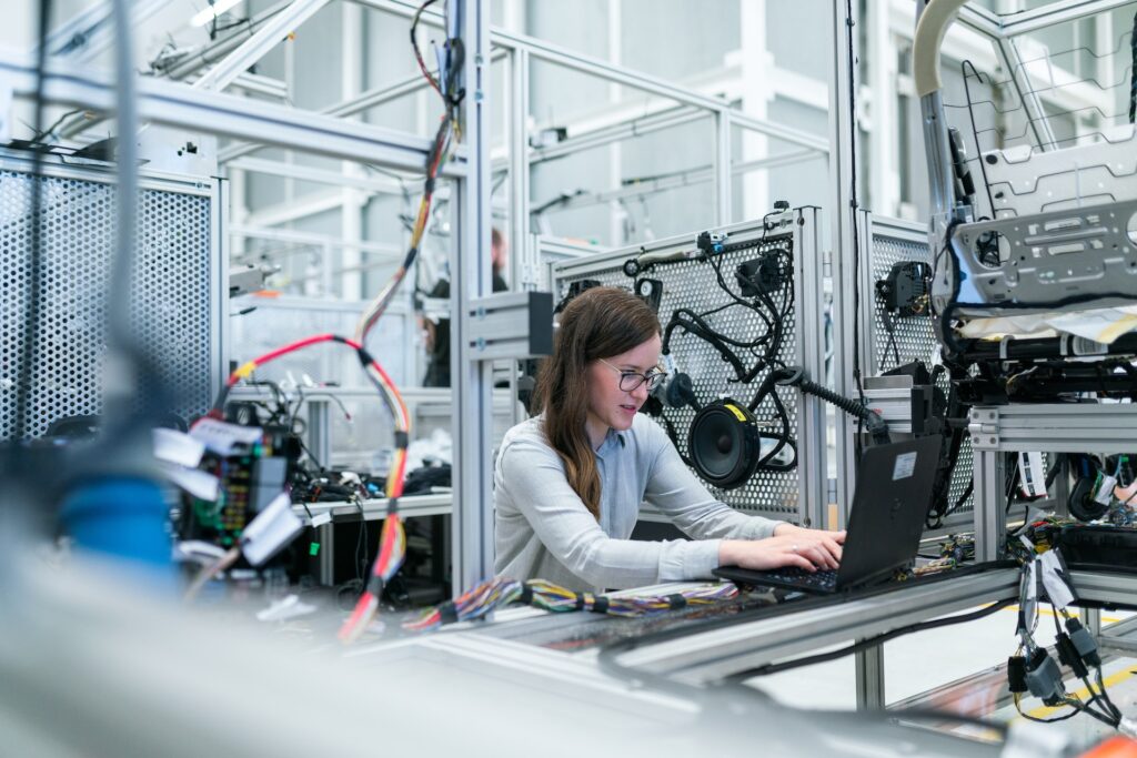 Young woman working in a robotics lab